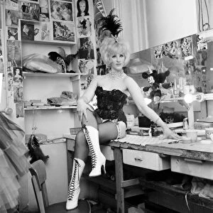 Show girl Audrey Crane seen here limbering up in her dressing room before going on stage