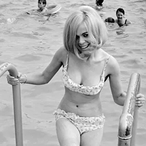 Girl in bikini enjoying the hot summer weather at Ryton open-air swimming pool, Coventry