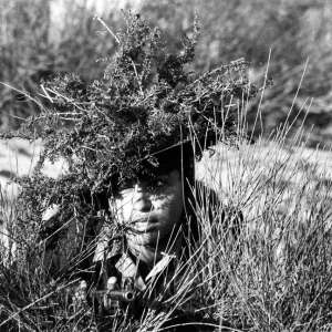 A girl of the Israeli Army in camouflage during basic training A girl of the Israeli Army in camouflage during basic training