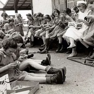 Girls from the Heritage Craft School at Chailey Sussex making badges for the Wings for