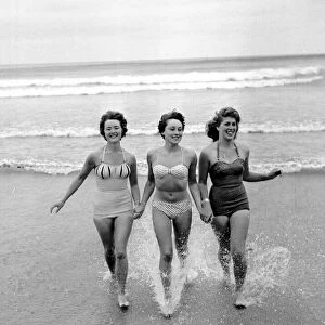 Girls running out of the sea. Newquay, Cornwall. 7th July 1959