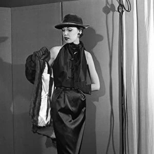 De Givenchy Fashion Show November 1952 Model wearing a black dress with black
