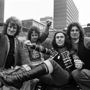 Glam rock group Slade posing for pictures in Birmingham City Centre. 25th March 1977 Glam rock group Slade posing for pictures in Birmingham City Centre. 25th March 1977