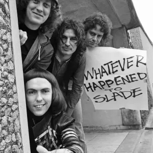 Glam rock group Slade posing for pictures in Birmingham City Centre. 25th March 1977 Glam rock group Slade posing for pictures in Birmingham City Centre. 25th March 1977