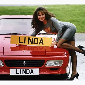 Glamour Model Linda Lusardi leans on a 512 TR Ferrari worth £