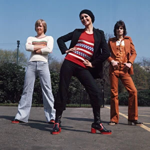 Glasgow fashion 1972 Two men and one woman wearing flared trousers, platform shoes