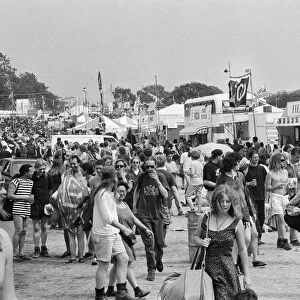 Glastonbury Festival 1994. General scenes. Festival goers walk besides
