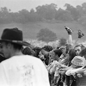 Glastonbury Festival 1994. General scenes of the crowd with a pair of legs