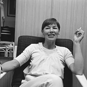 Glenda Jackson, actor, pictured enjoying a drink, a cigarette and a moment