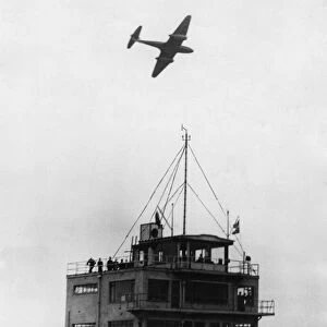 Gloster Meteor Aircraft passes over the Control Tower of Abbotsinch Airport, Paisley
