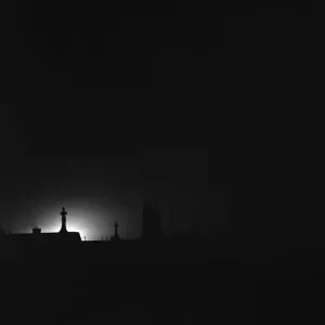 The glow from fires started by the bombing of the East End and docks light up London The glow from fires started by the bombing of the East End and docks light up London