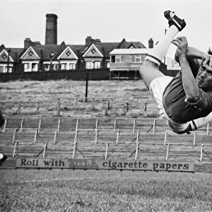 Goalkeeper Bill Glazier of Crystal Palace FC in mid flight diving for the ball during a