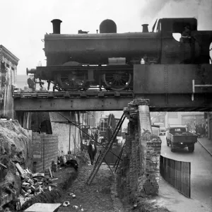 A goods train makes its way across the tow bridge in the centre of Stourbridge as it is