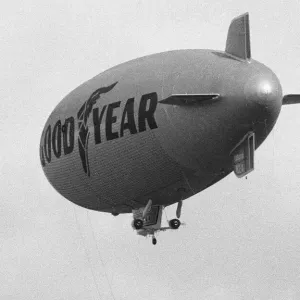The Goodyear airship Europa seen escorted by a Cessna 172 light aircraft during proving