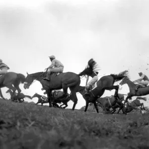 The Grand National at Aintree: Landing after jumping the canal turn is the eventual The Grand National at Aintree: Landing after jumping the canal turn is the eventual