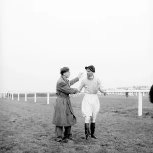 Grand National at Aintree Racecourse. Dejected jockey Dick Francis receives Grand National at Aintree Racecourse. Dejected jockey Dick Francis receives