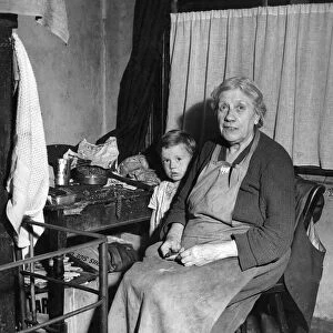 Grandmother and grandson. Circa 1938. Mrs. Shutt, 69, is one of Mr