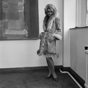 Graziella Fontana fashion June 1965 Model standing in the corner of a room wearing