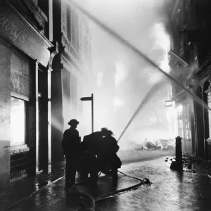 The Great Fire of London. Firemen at work on the city fire - they have a long night