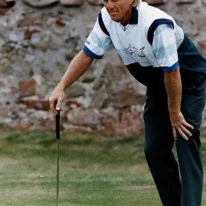 Greg Norman golfer lining up a put Greg Norman golfer lining up a put