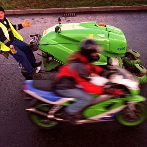 Greg Walker on green motorbike and Stuart Harden with his green machine road cleaner for