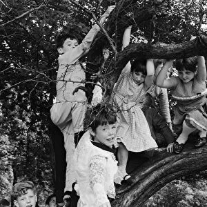 A group of children from Garston, Liverpool enjoy a day out at Sefton Park in the summer