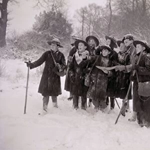 A group of children playing outside in the snow January 1954