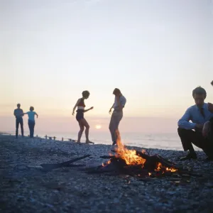 Group of friends enjoying themselves during a day out at the seaside in Greece Group of friends enjoying themselves during a day out at the seaside in Greece