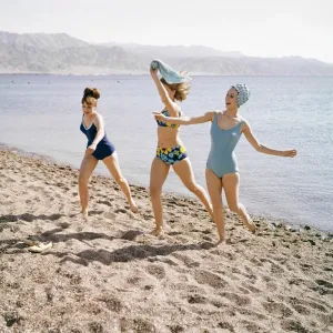 Group of friends enjoying themselves during a day out at the seaside in Greece Group of friends enjoying themselves during a day out at the seaside in Greece