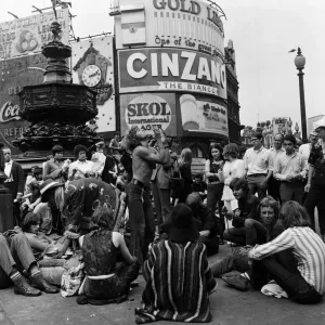 A group of hippies in Piccadilly Circus, London. 15th August 1969 A group of hippies in Piccadilly Circus, London. 15th August 1969