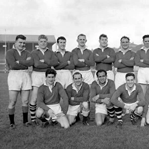 Group pic of Wigan players before training in their cup strip of plain red jerseys