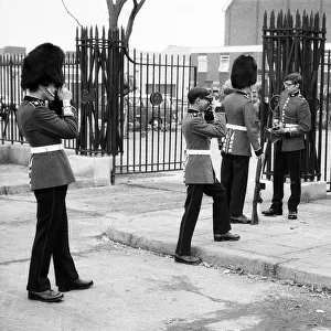 Guardsmen have a snapshot of themselves at the Wellington Barracks