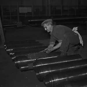 Gun barrels being greased before being attached to tanks under construction at the Royal Gun barrels being greased before being attached to tanks under construction at the Royal
