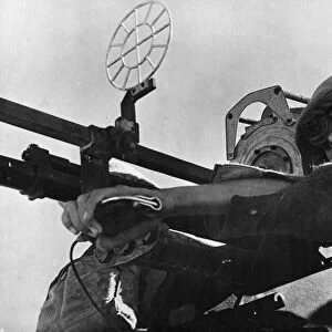 A gunner of an RAF Regiment Anti-Aircraft Flight mans a 20mm Hispano-Suiza anti-aircraft