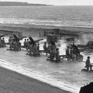 Guns of the 4th Light Regiment firing their salute from the promenade at Roker