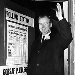 Gwynfor Evans of Plaid Cymru, leaving the polling station after voting in
