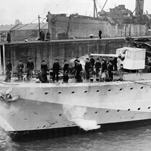 H. M. S. Hesperus enters a harbour, showing damage to her bows caused by ramming a German