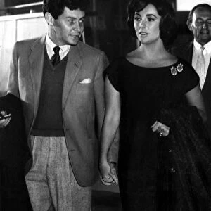 Hand in hand Elizabeth Taylor and husband Eddie Fisher leave London Airport for Paris 13