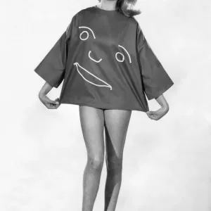 This Happy Face'shirt is the talk of the beaches. In brick red sailcloth This Happy Face'shirt is the talk of the beaches. In brick red sailcloth