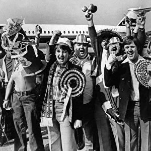 Happy Liverpool fans at Speke Airport before flying to Italy to watch their team take