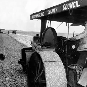 Bill Harmeston uses a Northumberland County Council steam roller to level out the track