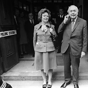 Harold Wilson and his wife Mary Wilson exit from a polling station after voting