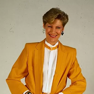 Harriet Buchan actress May 1987 wearing yellow jacket skirt suit and white blouse shirt