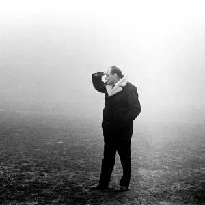 Harry Potts Manager of Burnley F. C. peers into the gloom at Manchester City ground today Harry Potts Manager of Burnley F. C. peers into the gloom at Manchester City ground today