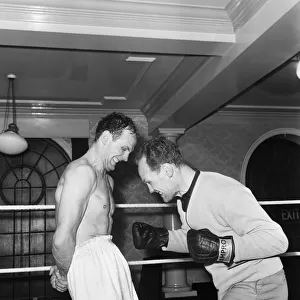Having his stomach muscles strengthened is British Heavyweight Champion Henry Cooper