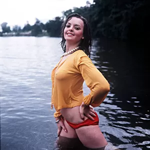 Hazel Duncan - Glamour Model wearing red bikini bottoms and yellow top