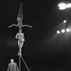 Print of a Head Balancing Act at Bertram Mills Circus in Cambridge Print of a Head Balancing Act at Bertram Mills Circus in Cambridge