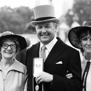 Head of Laker Airways Freddie Laker with his wife and mother at Buckingham Palace after Head of Laker Airways Freddie Laker with his wife and mother at Buckingham Palace after