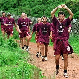 Heart of Midlothian players being led by Stephane Adame during the first day of training