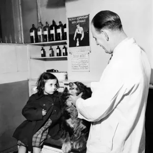 Helen with her pal Laddie'at the vets today. January 1953 D441